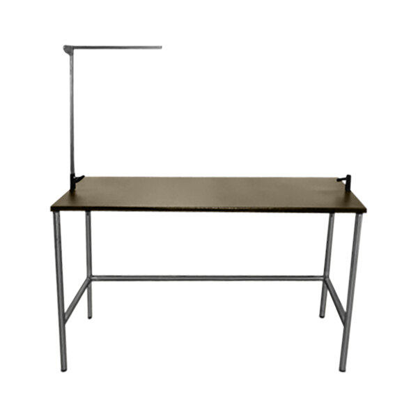 A Groomer's Best stainless steel grooming table with a metal frame and a light on top.