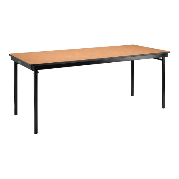 A National Public Seating rectangular table with black legs and a brown top.