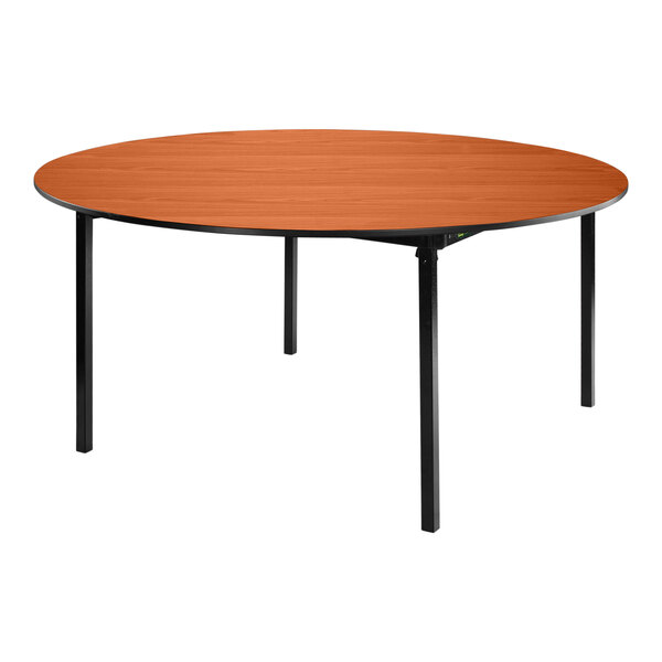 A National Public Seating round wood table with black legs.