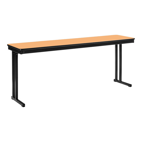 A long rectangular table with black cantilever legs and a fusion maple top.