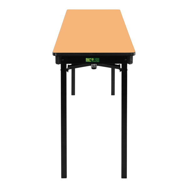 A National Public Seating rectangular folding table with T-molded edges and a light brown top.