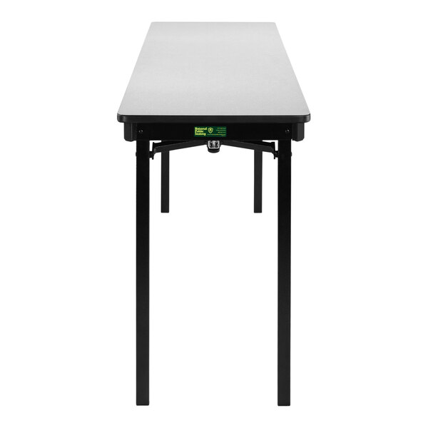 A National Public Seating gray rectangular folding table with black legs.