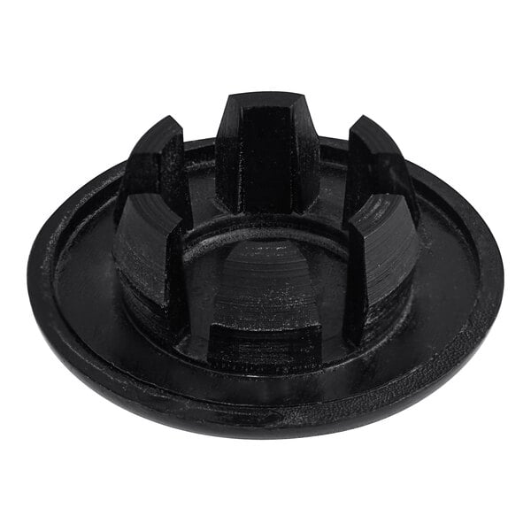 A close-up of a black Bunn plastic plug with four holes.