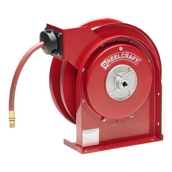 A red Reelcraft hose reel with a hose attached.