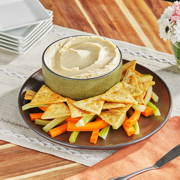 A plate of vegetables with Rind Horseradish Plant-Based Cream Cheese on a table