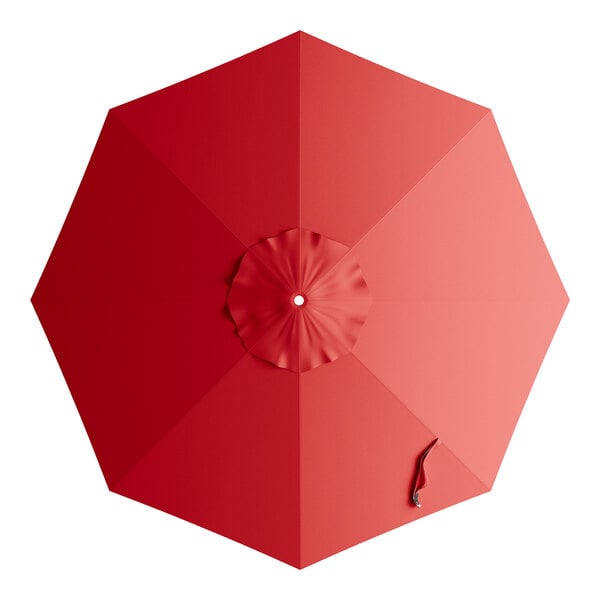 A red umbrella canopy for a round table with a hole in the top.
