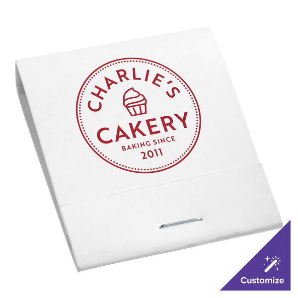 A white matchbook with red text on the cover.