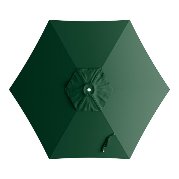 A green umbrella canopy for a round table with a white handle.