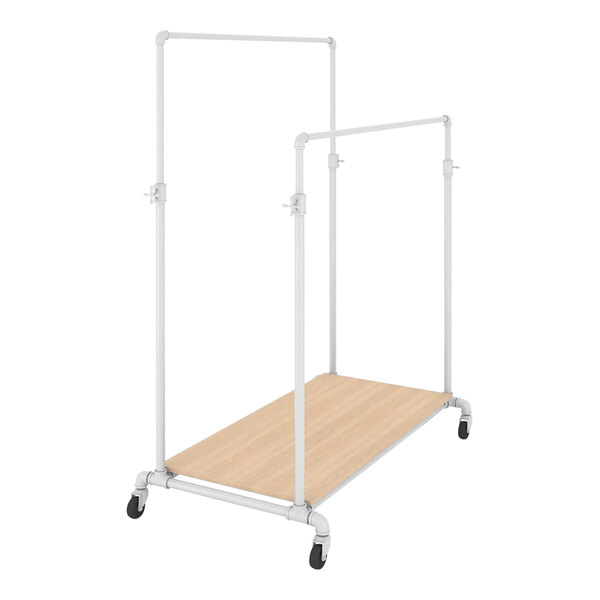 A white metal Econoco ballet garment rack with wood base shelves.