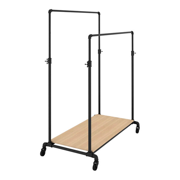 An Econoco black metal ballet garment rack with a raw oak wood shelf.