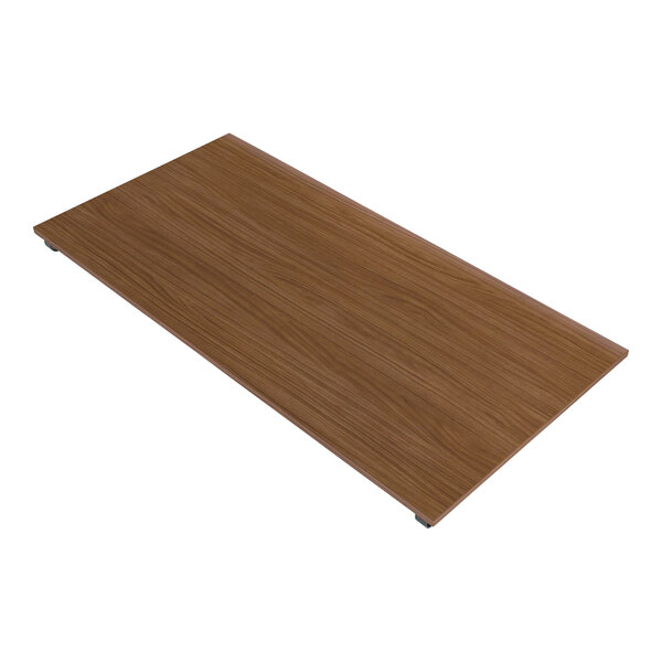 A brown rectangular melamine shelf for a clothing rack.