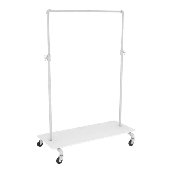 A white metal rectangular clothing rack with black wheels.