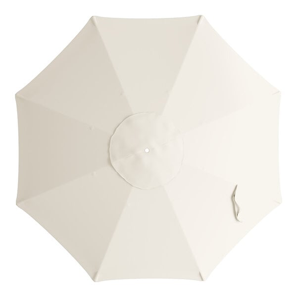 A white circular canopy for a Lancaster Table & Seating umbrella with a strap.