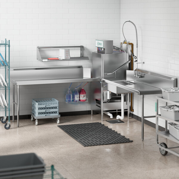 A stainless steel Regency dishtable with a sink in a school kitchen.