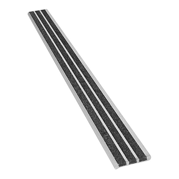 A white metal strip with black grit on the top.