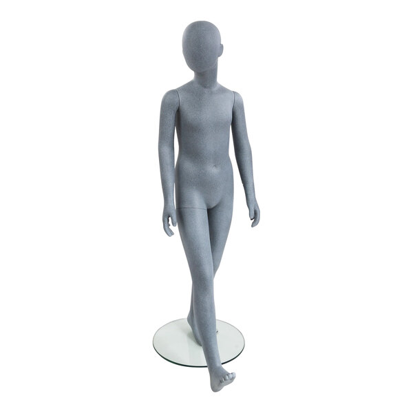 An Econoco Slate 6-year-old unisex mannequin standing on a glass surface.