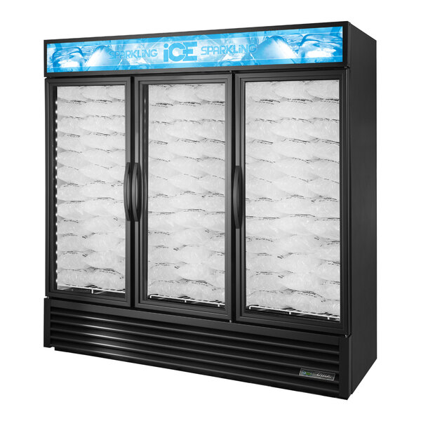 A True black glass door ice merchandiser with ice inside.