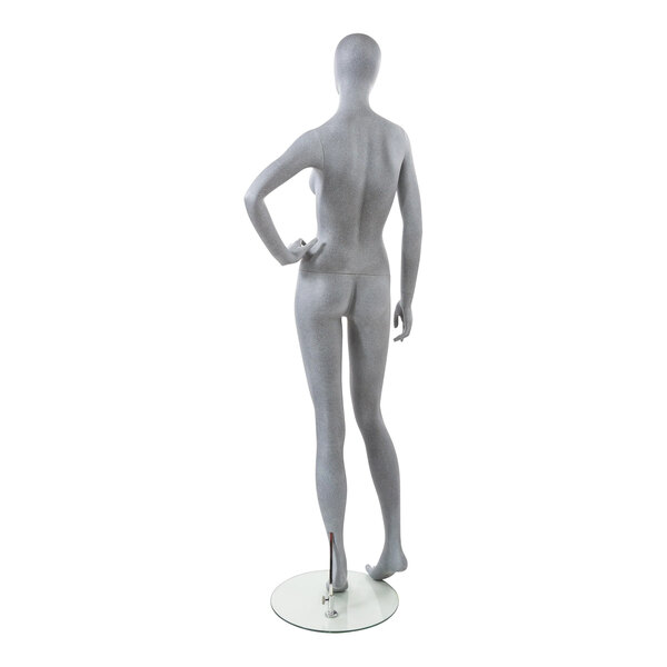 An Econoco female mannequin with an oval head, left hand on hip, and bent right leg.