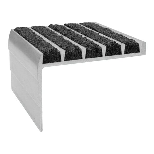 A close-up of a Wooster black and grey stair tread with black grit strips.