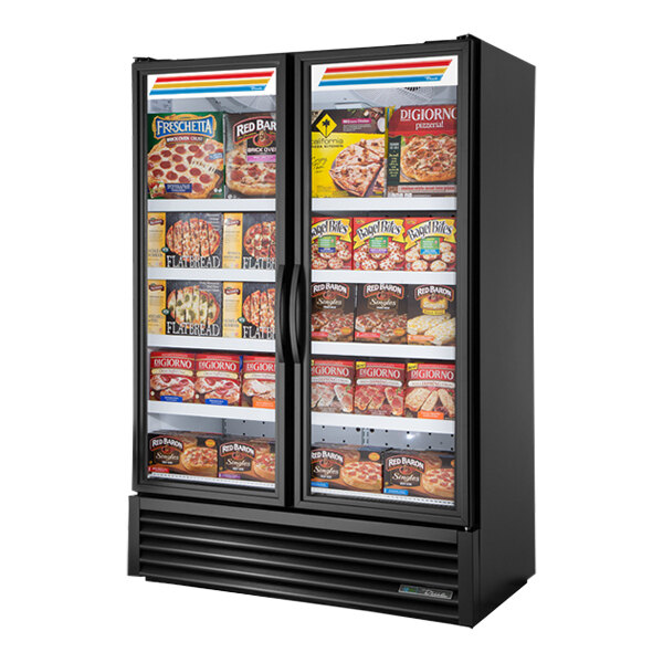 A True glass door merchandiser freezer with full length doors full of food.