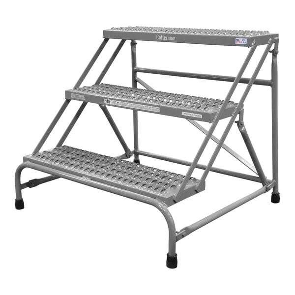 A gray powder-coated steel Cotterman step stand with 3 steps and serrated treads.