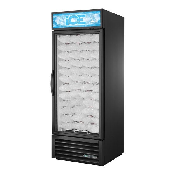 A black True ice merchandiser with clear plastic bags of ice inside.