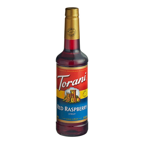 A Torani plastic bottle of red raspberry syrup with a gold cap.