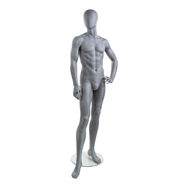 A slate male mannequin with no shirt on, with left hand on hip and right leg forward.