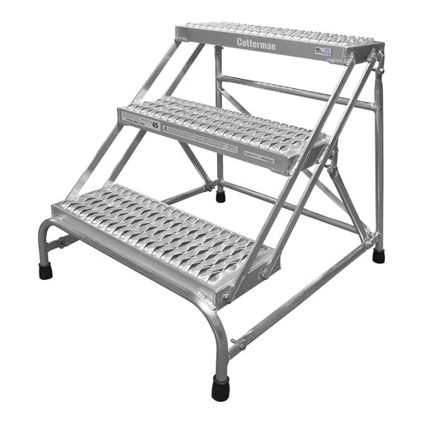 A white metal Cotterman 3-step industrial ladder.