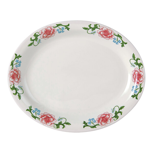 A Tuxton China oval platter with pink flowers on it.