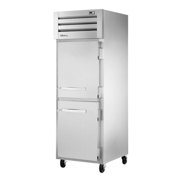 A white True reach-in refrigerator with silver handles and two solid half doors.