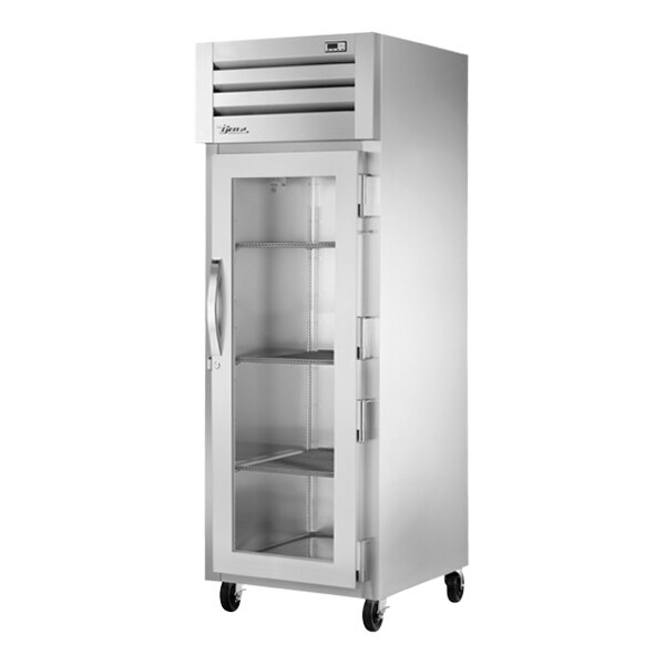 A True reach-in freezer with glass doors.