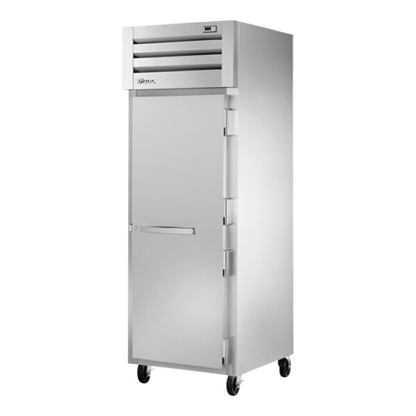 A silver True Spec Series reach-in refrigerator with a white door.