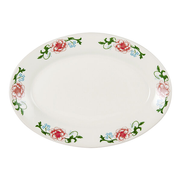A white Tuxton china oval platter with pink flowers on it.