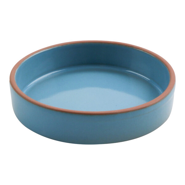 A blue terracotta bowl with a brown rim.