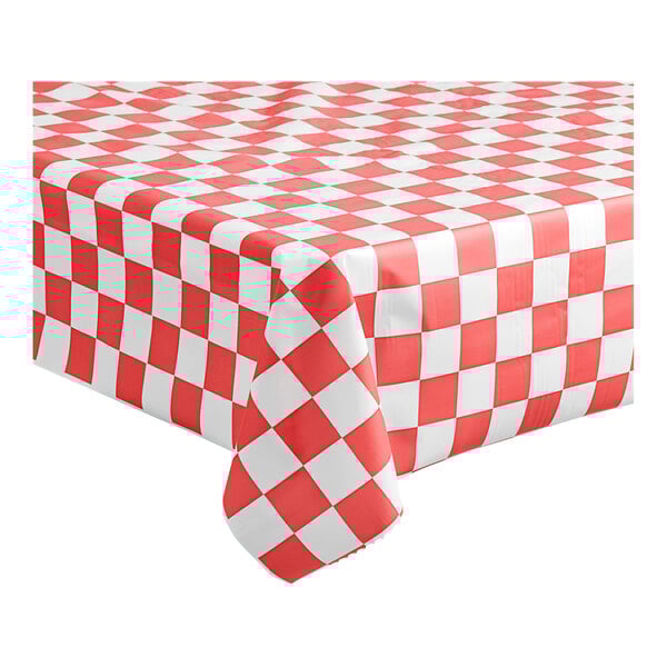 A red and white checkered Table Mate tablecloth on a table.