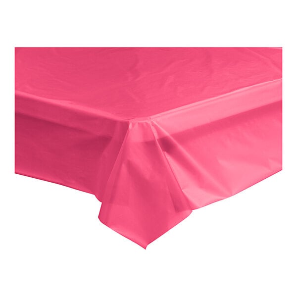 A Table Mate hot pink plastic tablecloth on a table.