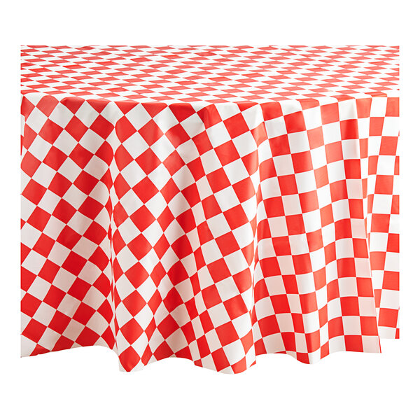 A red and white checkered Table Mate plastic table cover.