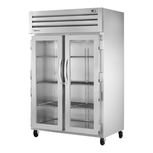 A True glass door reach-in refrigerator with two glass doors.