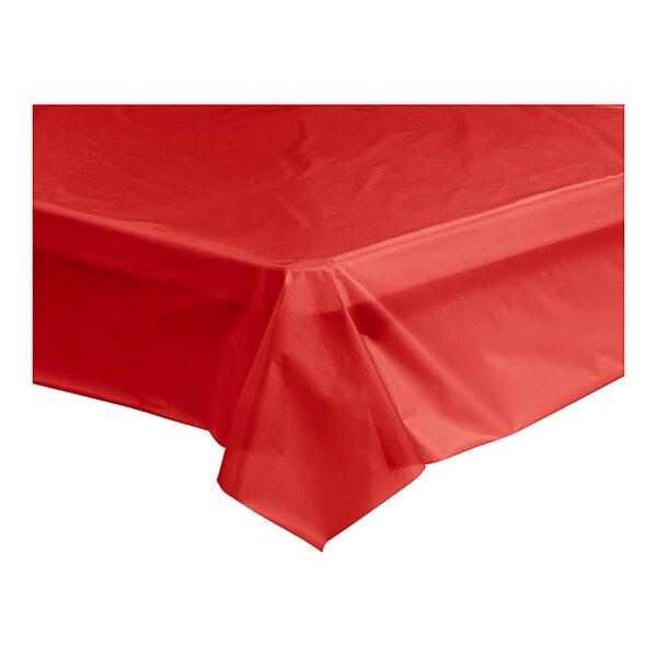 A red Table Mate plastic table cover roll on a table.