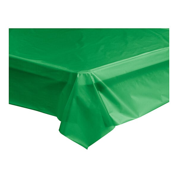 A green plastic Table Mate table cover on a table.