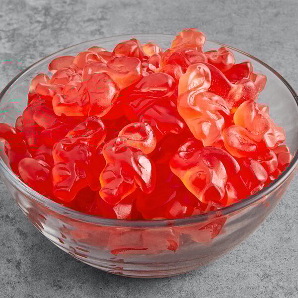 A bowl of Vidal pink flamingo gummies on a table.