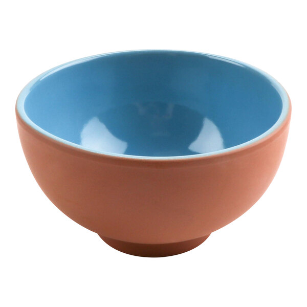 A blue terracotta bowl with a blue rim.