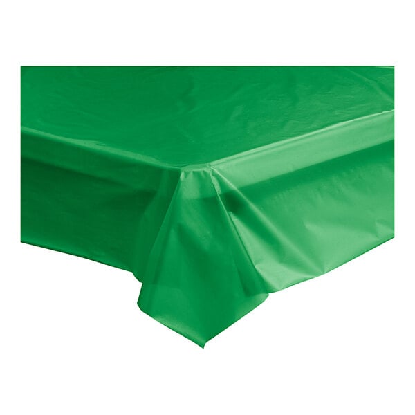 A green plastic Table Mate table cover on a white table.