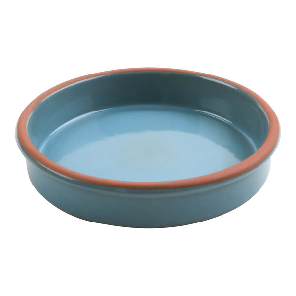 A blue terracotta casserole dish with a red rim.