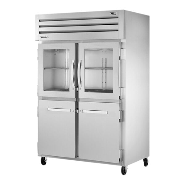 A white True reach-in refrigerator with glass and solid half doors.