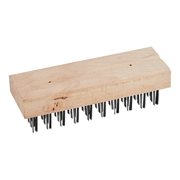 A wooden brush with black metal bristles.