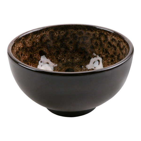 A brown terracotta bowl with a white heart design.