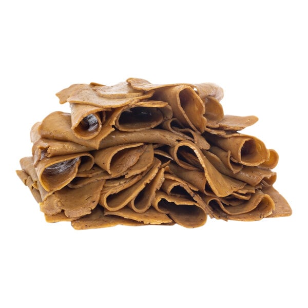 A stack of plant-based vegan roast beef slices.