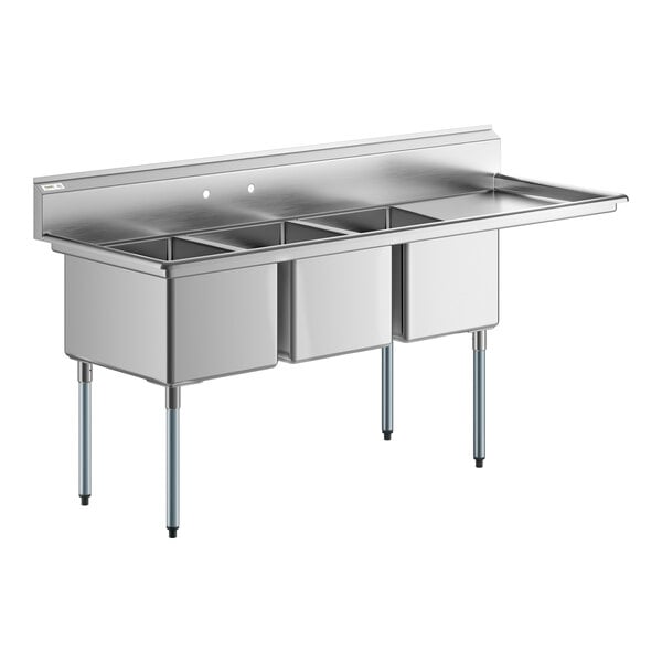 A Regency stainless steel three compartment sink with a right drainboard.